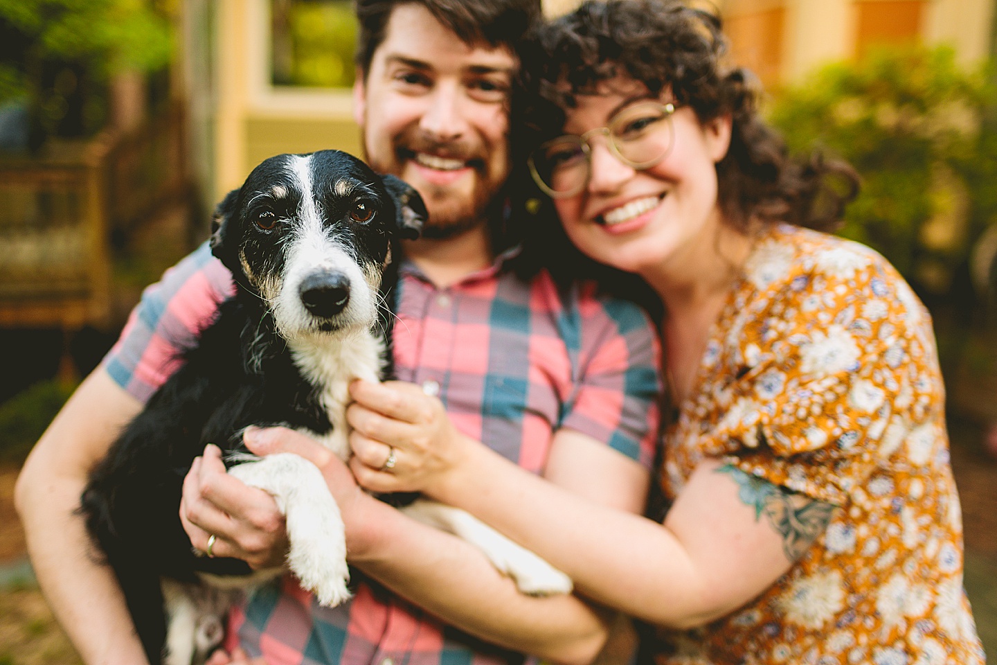 Couple holding their dog during pictures