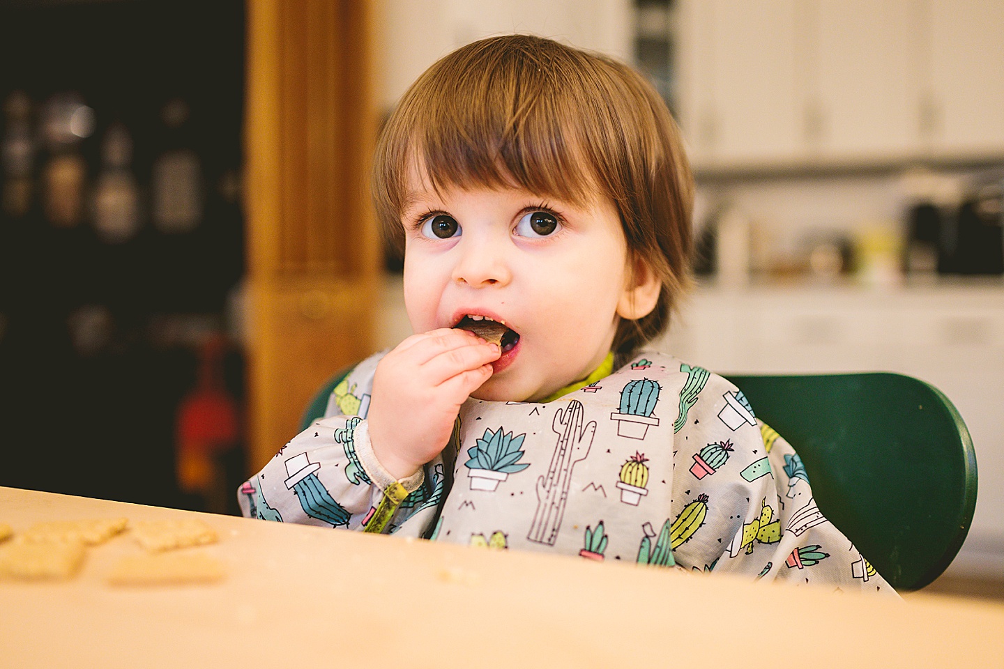 Kid getting ready to eat with jacket