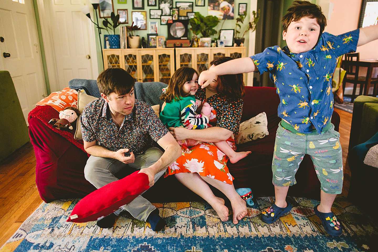 Family portraits on couch in Durham