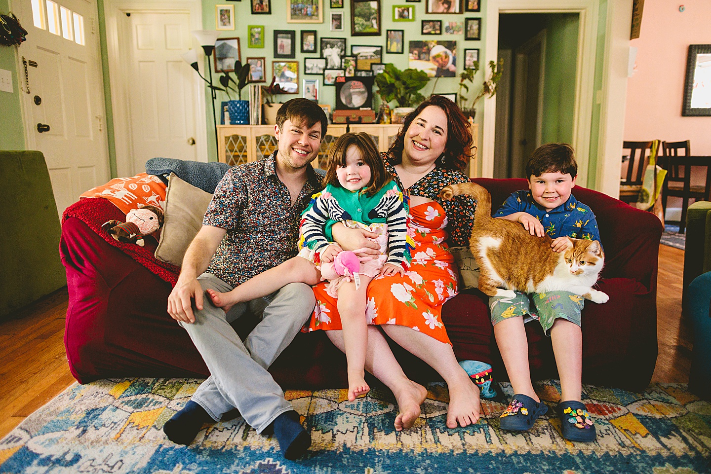 Family portraits on couch in Durham