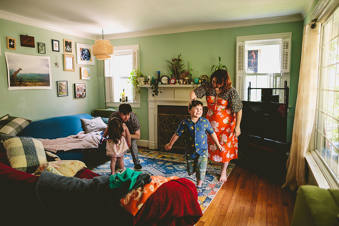 Family dancing around living room