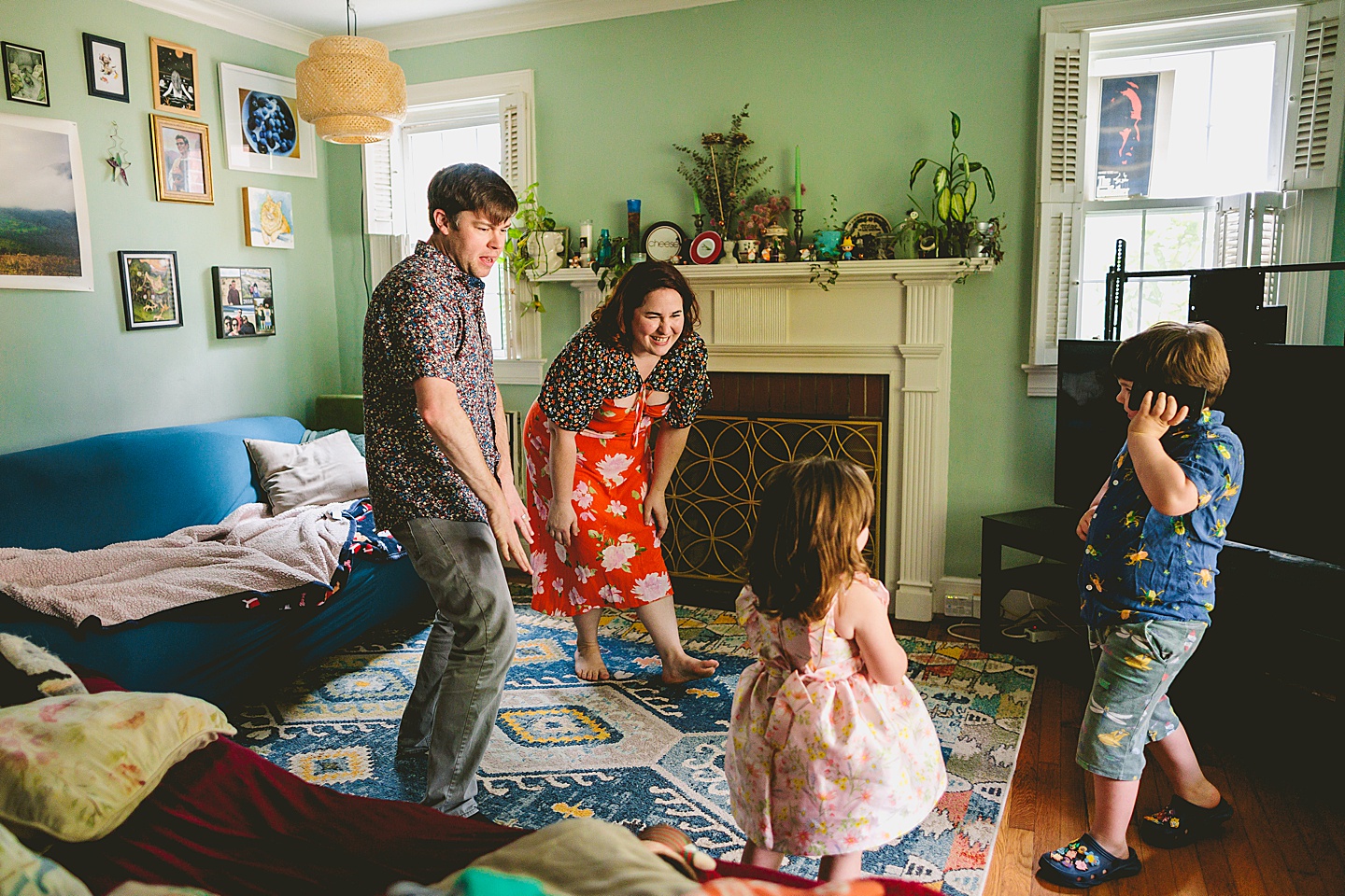 Family dancing around living room