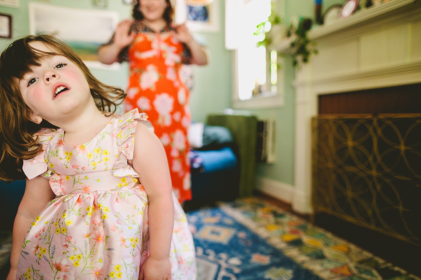 Family dancing around living room