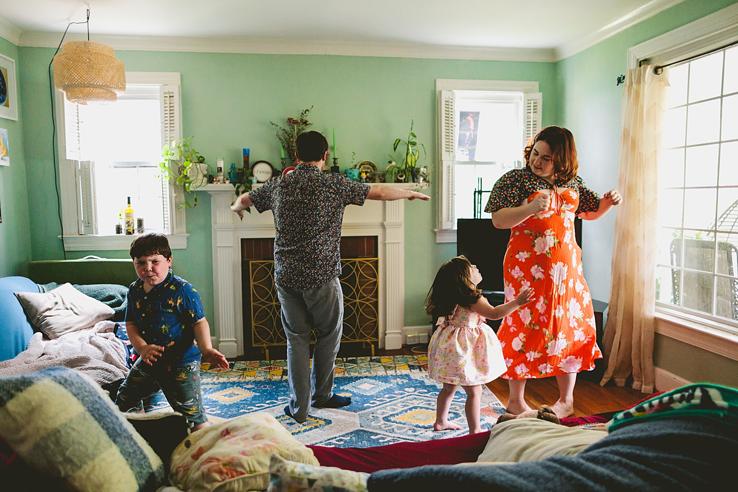 Family dancing around living room