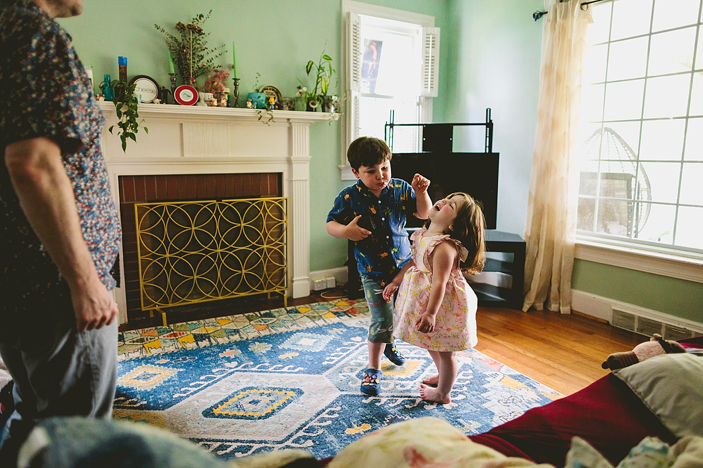 Family dancing around living room