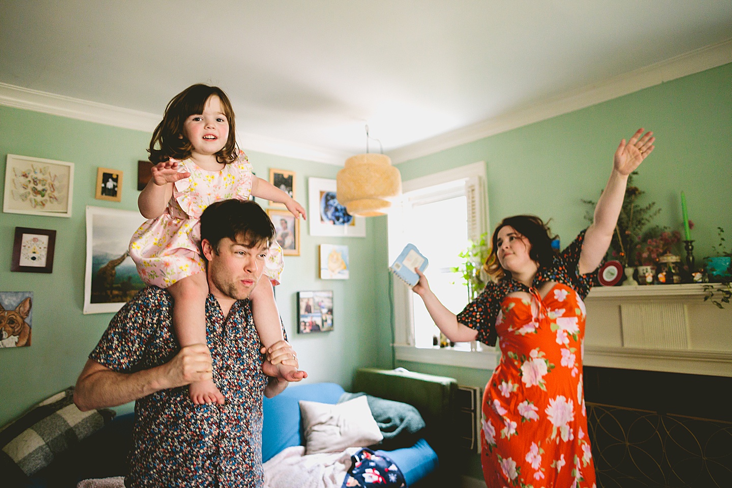 Family dancing around living room