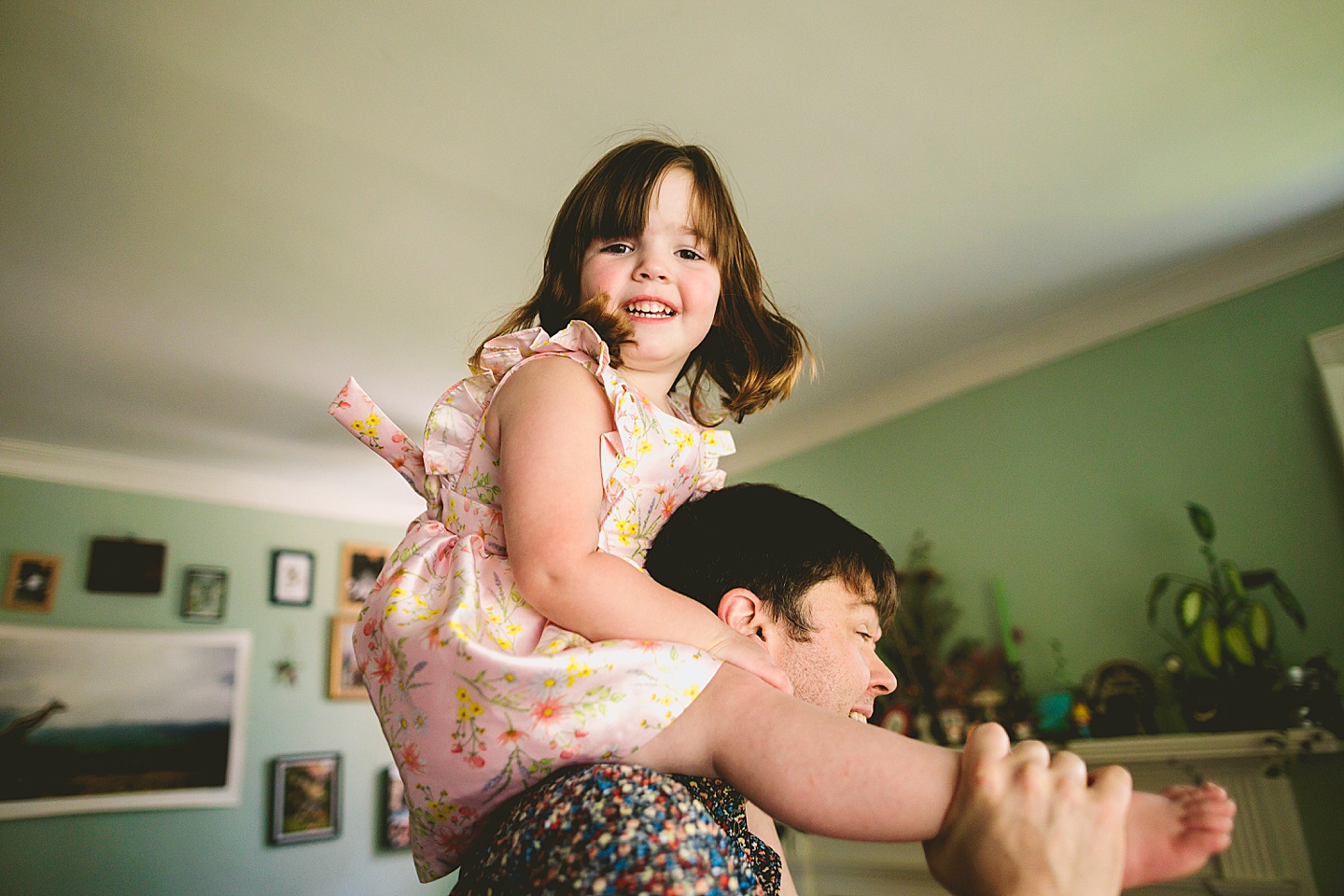 Family dancing around living room