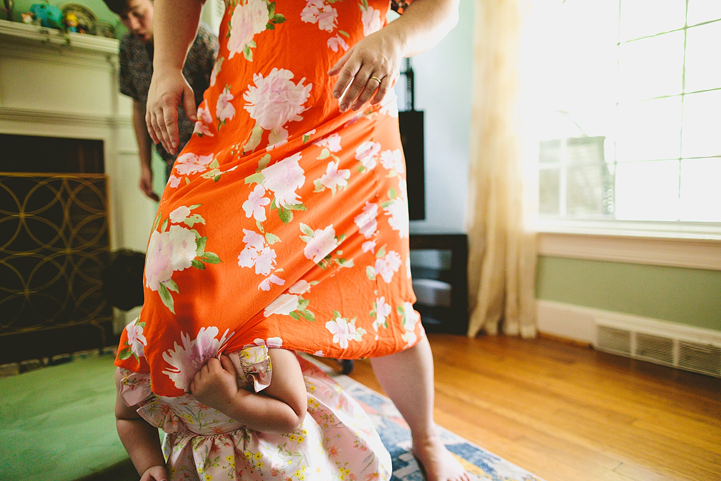 Family dancing around living room