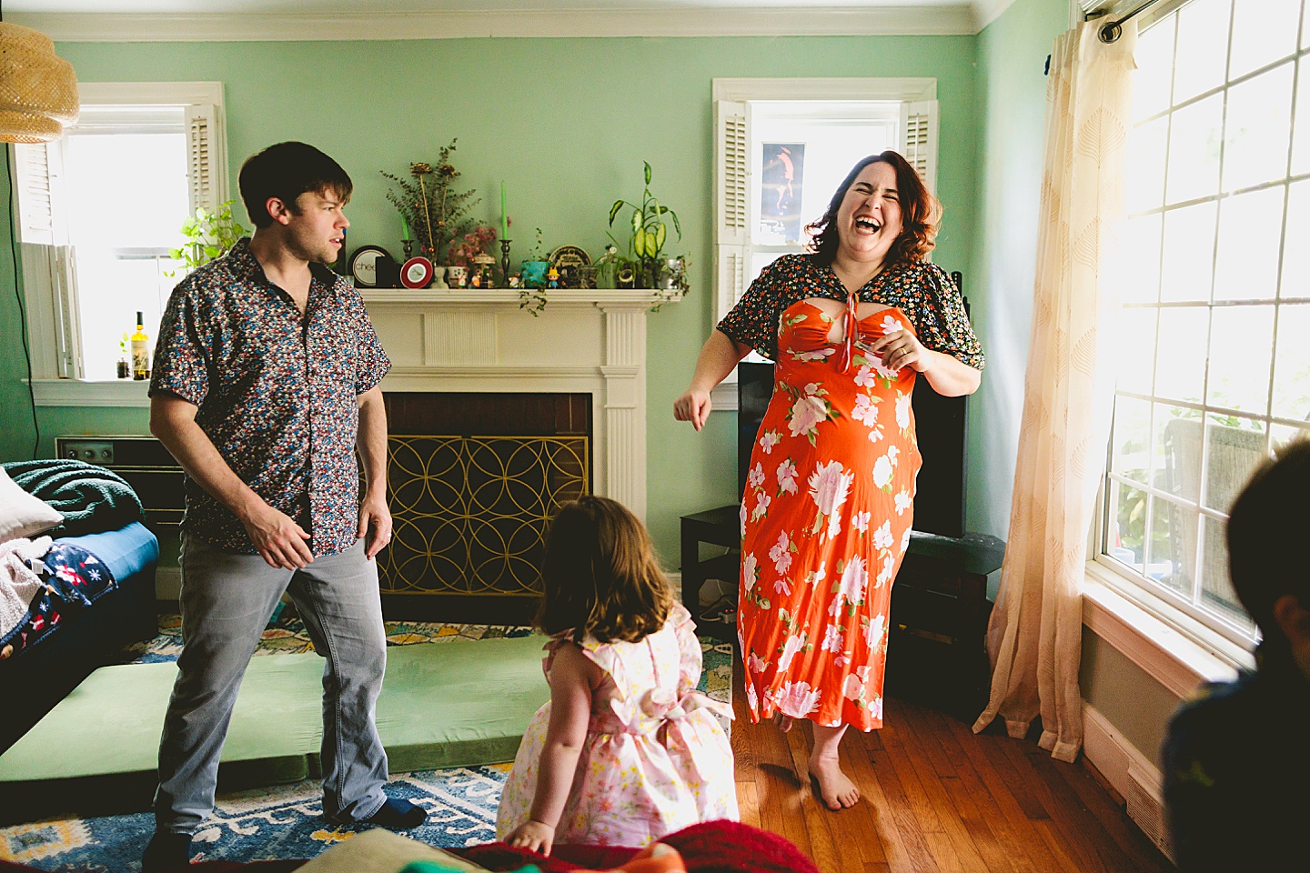 Family dancing around living room