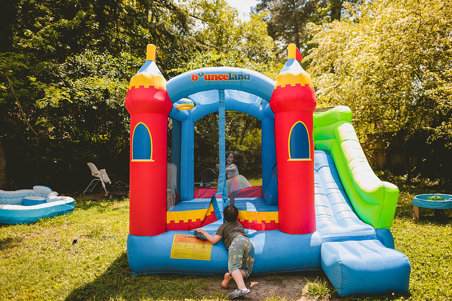 Kids enter inflated bounce house