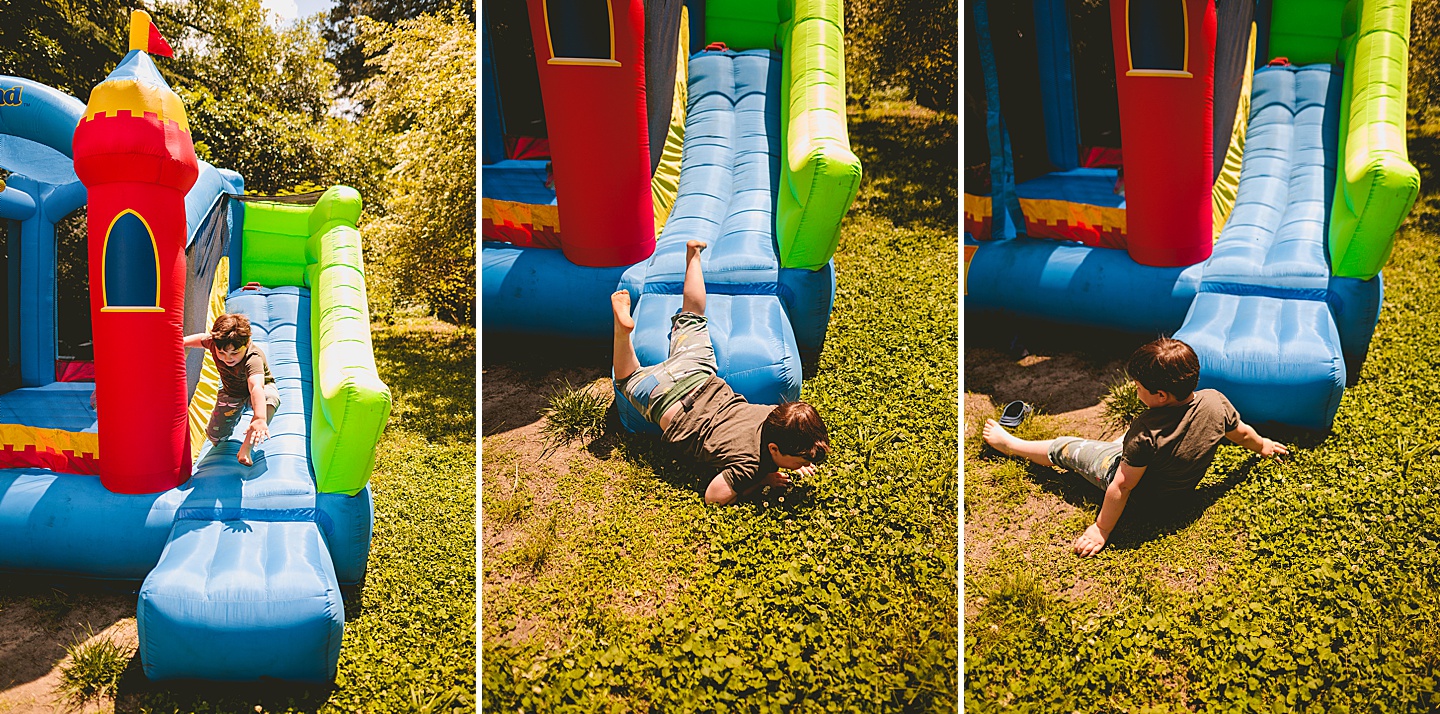 Family playing in bounce house during family photos in Durham