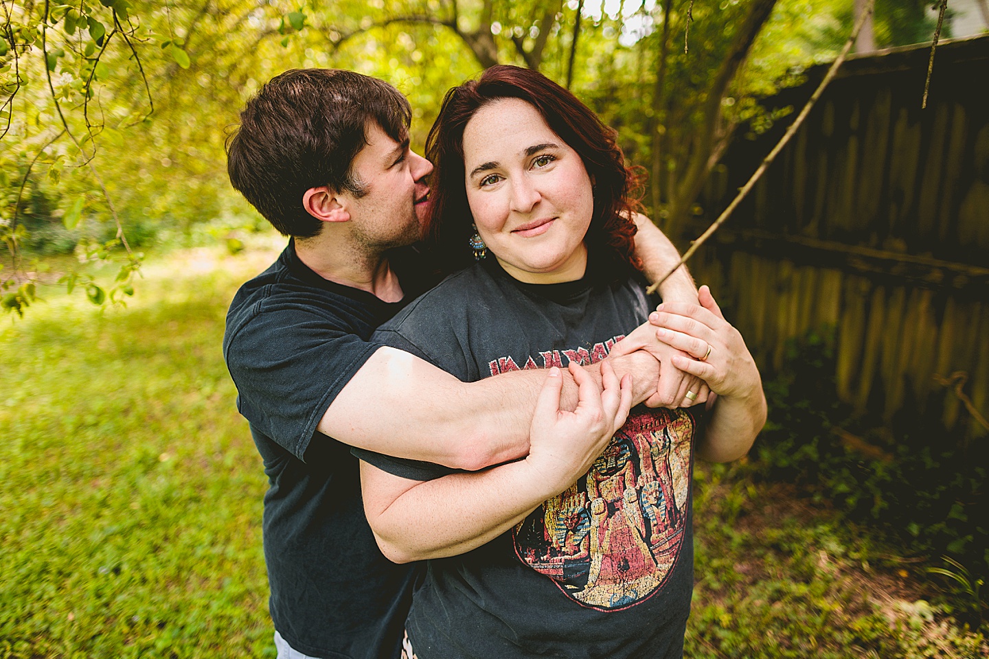 Couple smiling in yard for photos in Durham