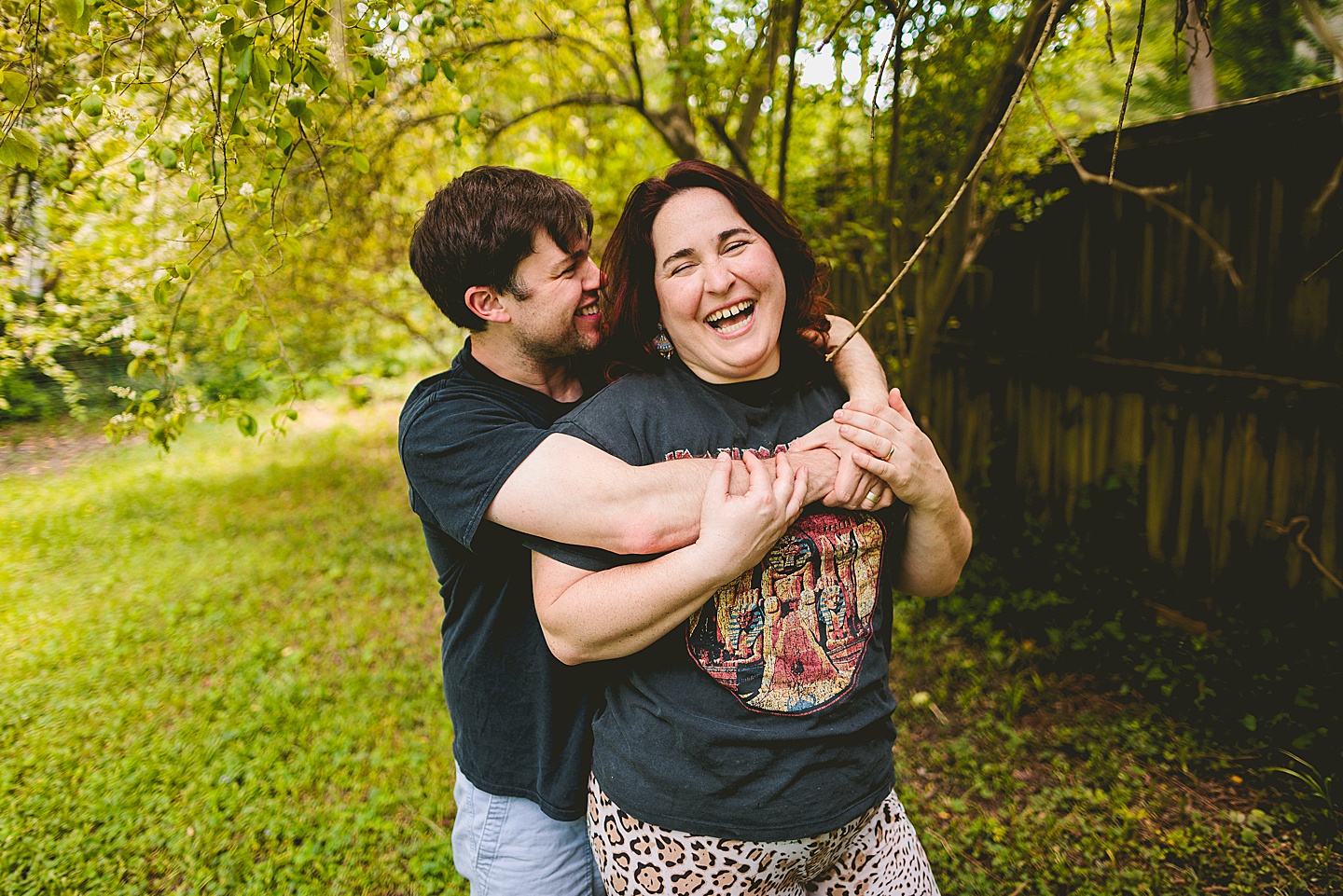 Couple smiling in yard for photos in Durham