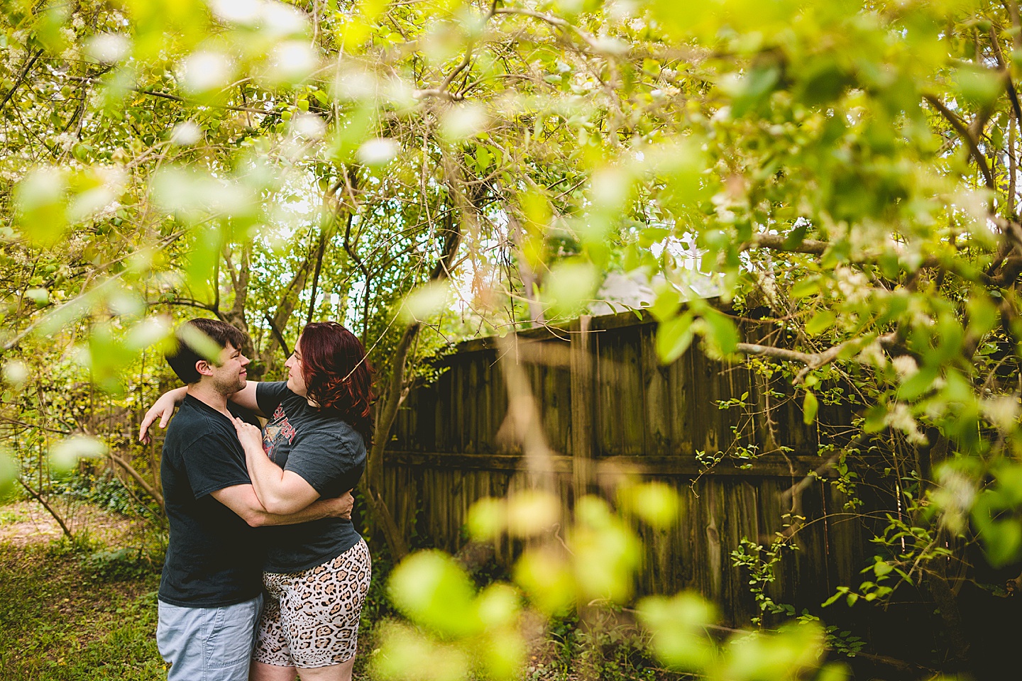 Couple smiling in yard for photos in Durham