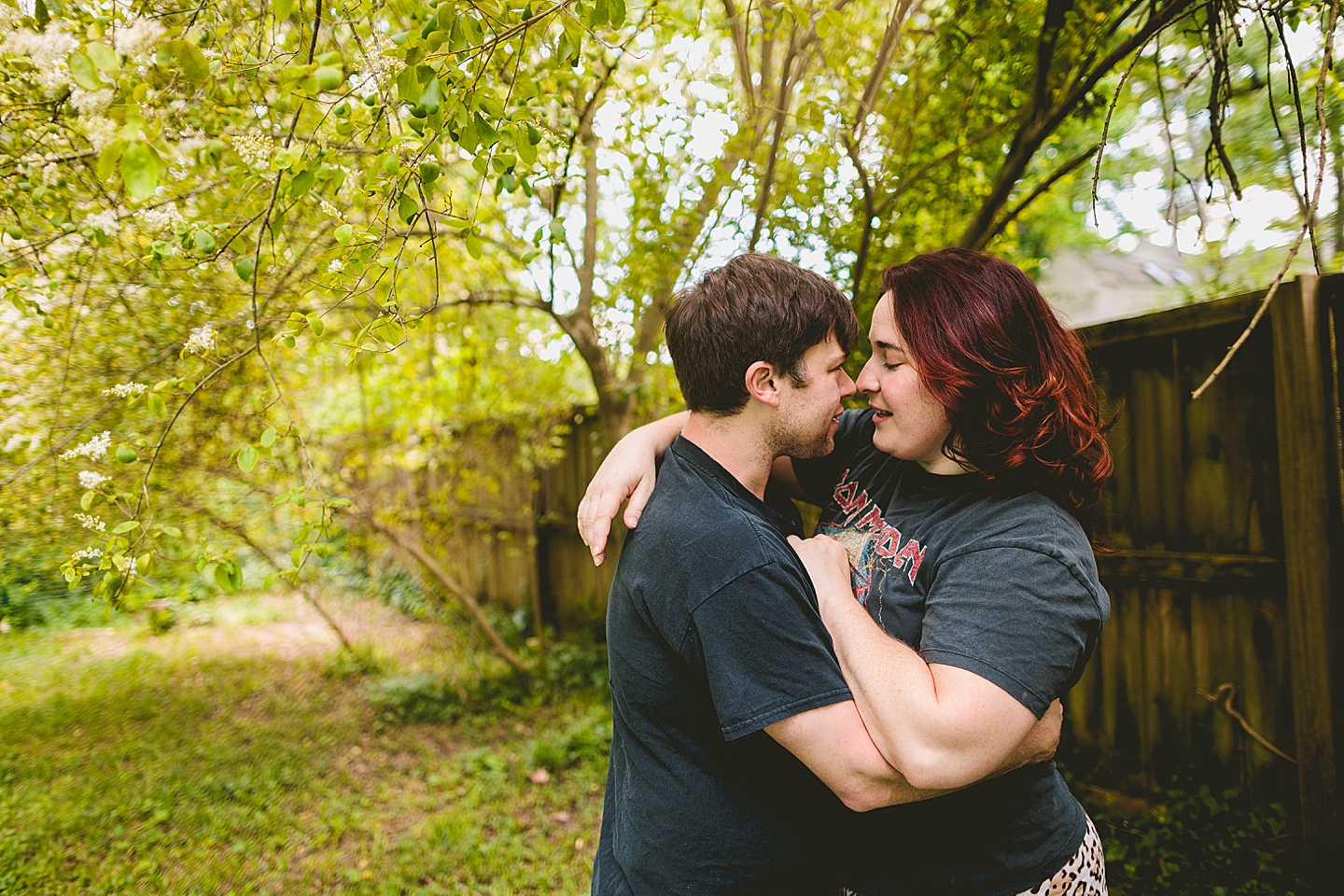 Couple smiling in yard for photos in Durham