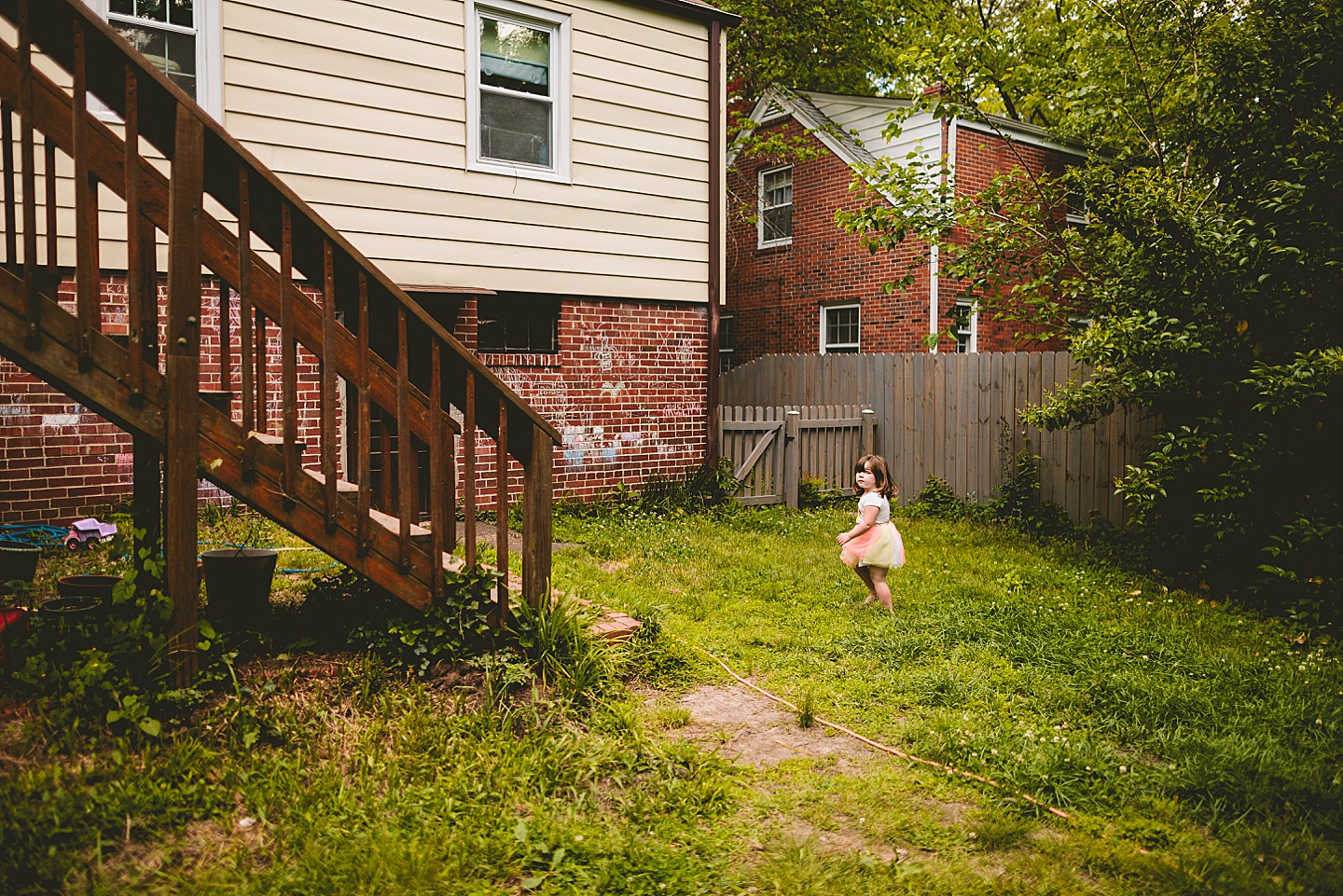 Girl running through yard