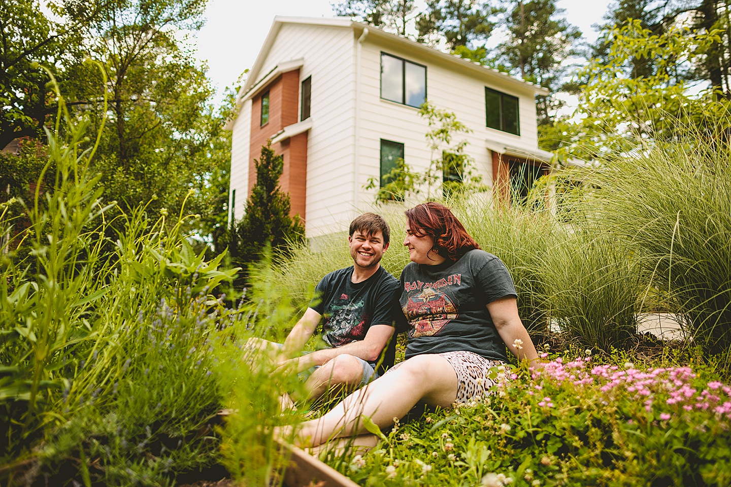 Parents smiling at kids playing in yard