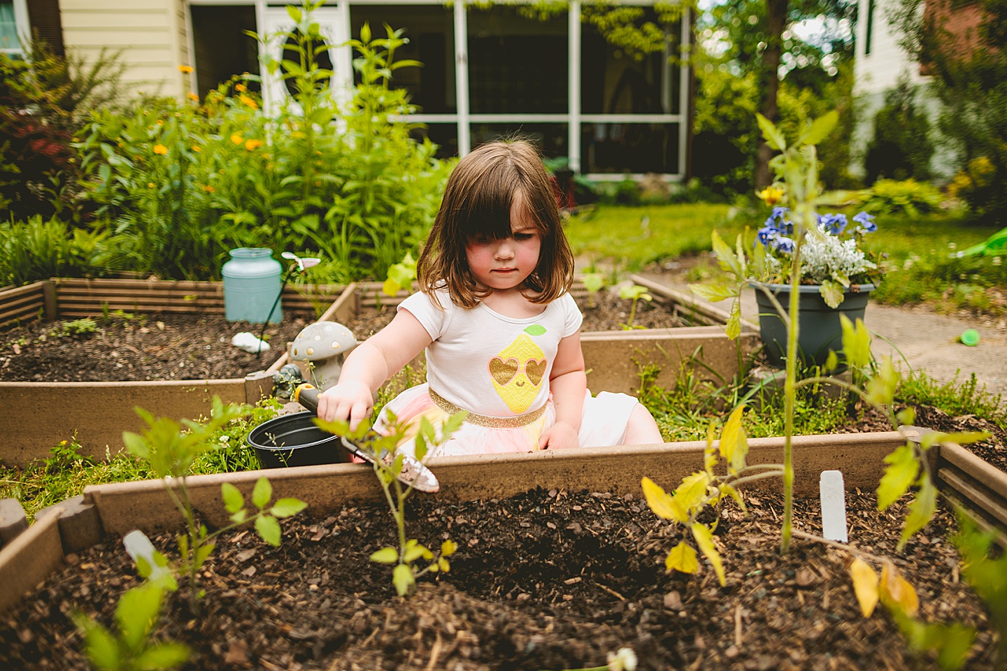 Family gardening in Durham NC during photos