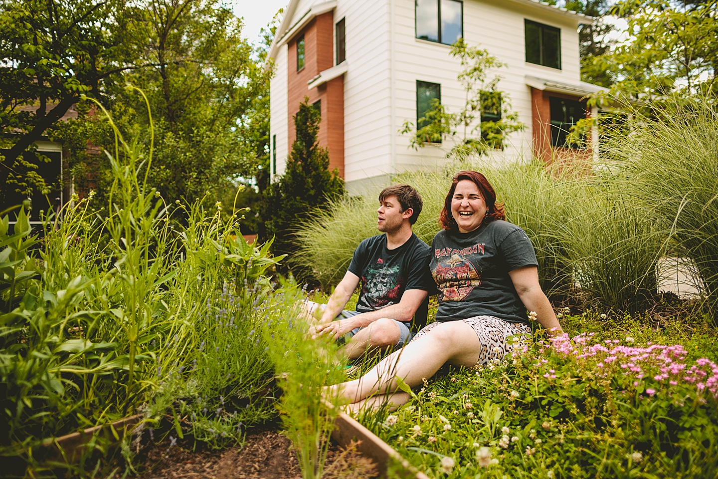 Parents smiling at kids playing in yard