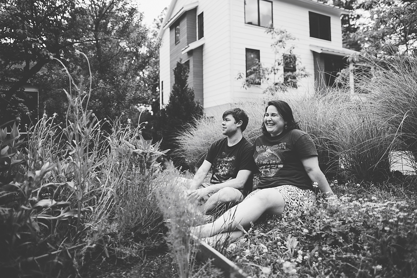 Parents smiling at kids playing in yard