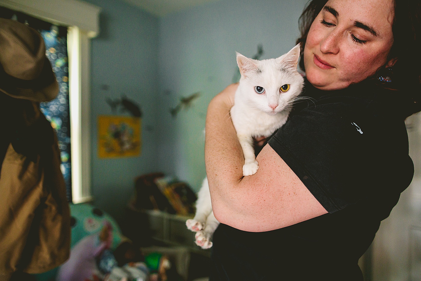 White cat with blue and green eyes