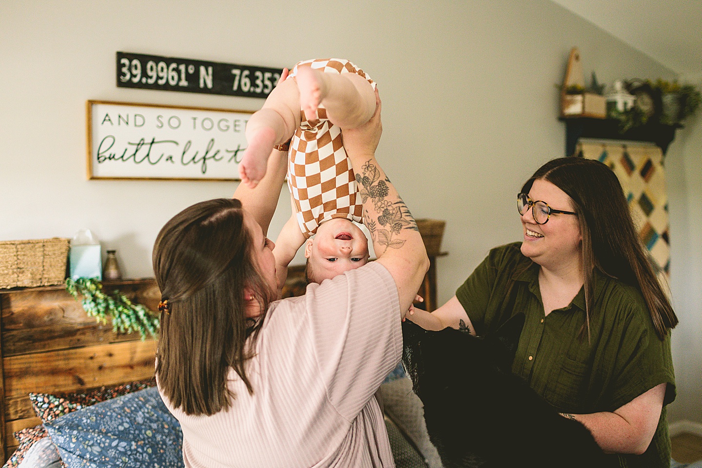 Mom holding laughing baby