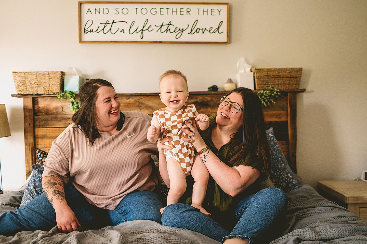 Couple holding smiling baby