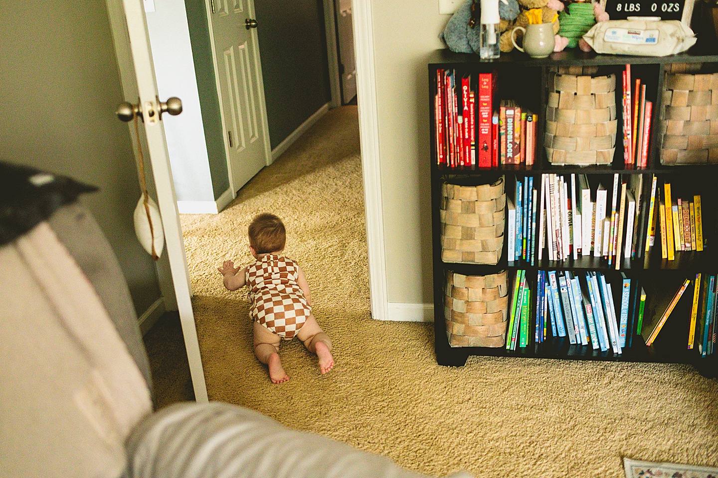 Baby crawling out of room