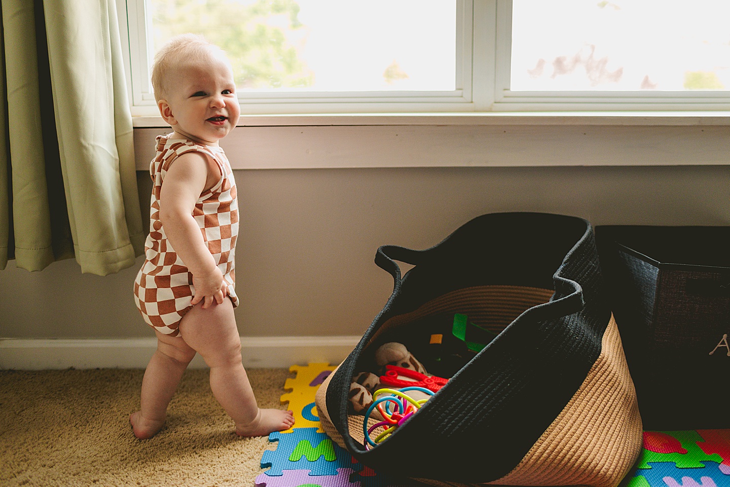 Baby standing at window