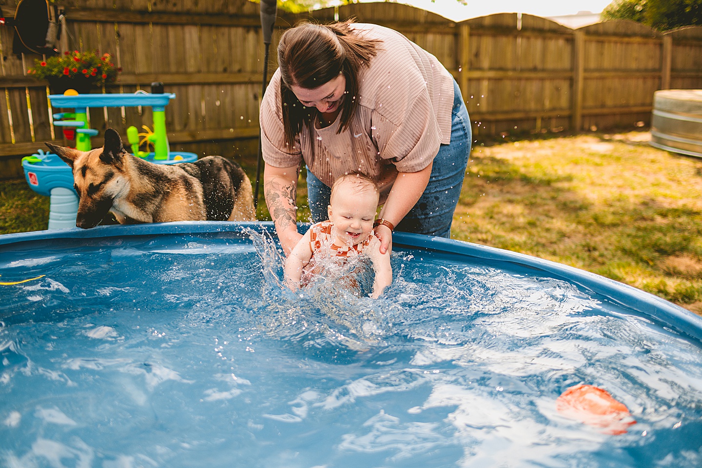 Baby playing in a pool with moms