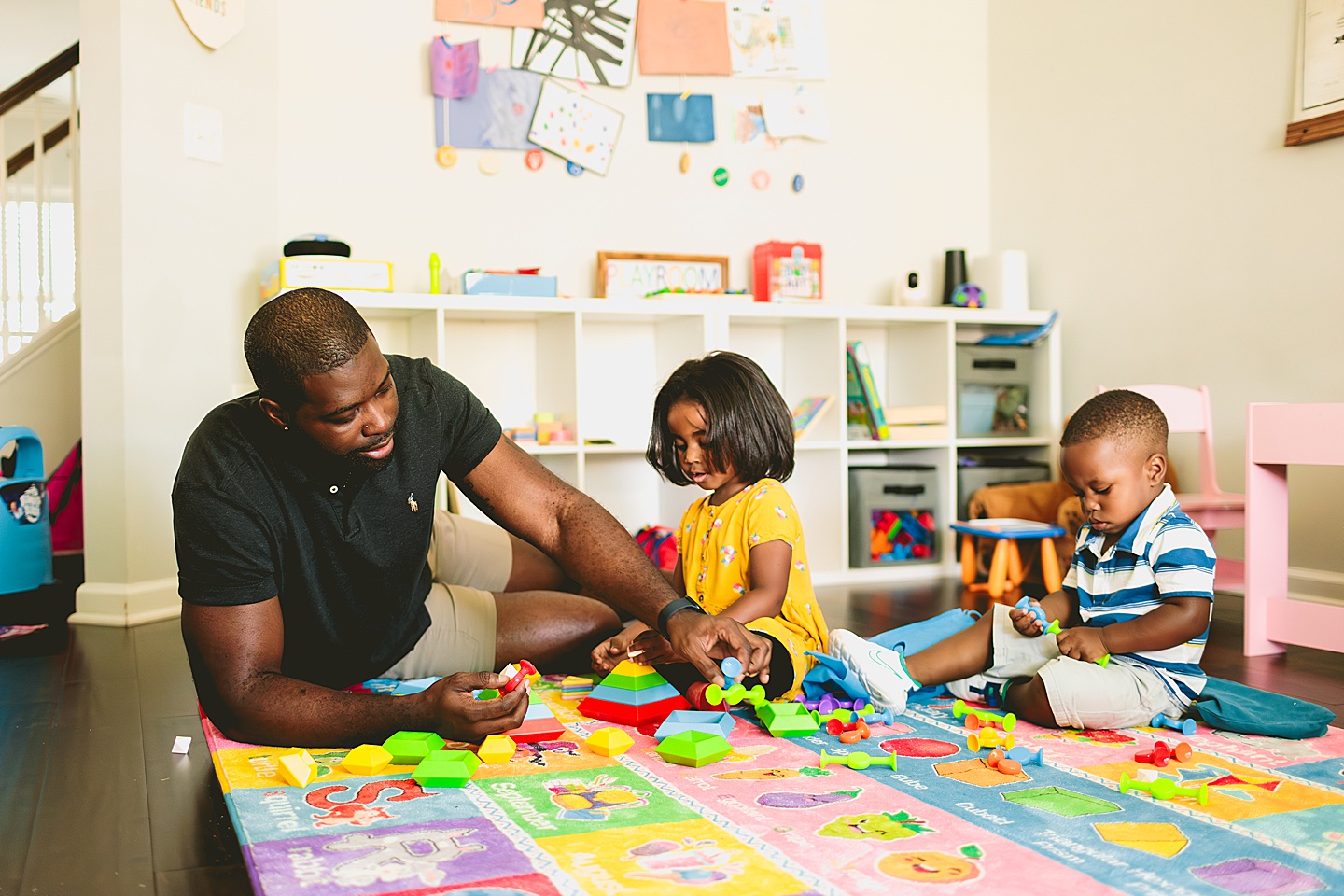 Dad playing Legos with kids