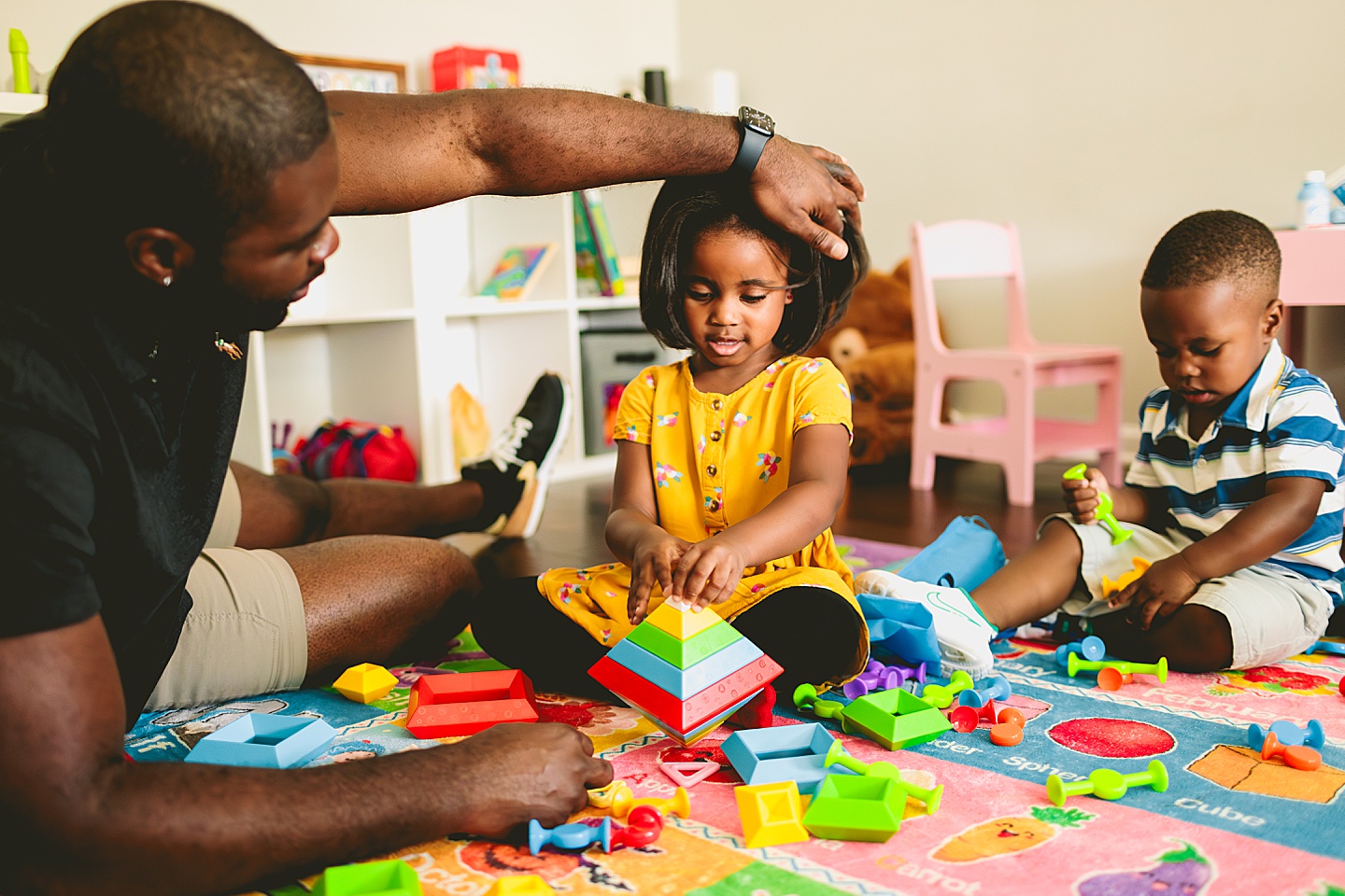 Dad playing Legos with kids