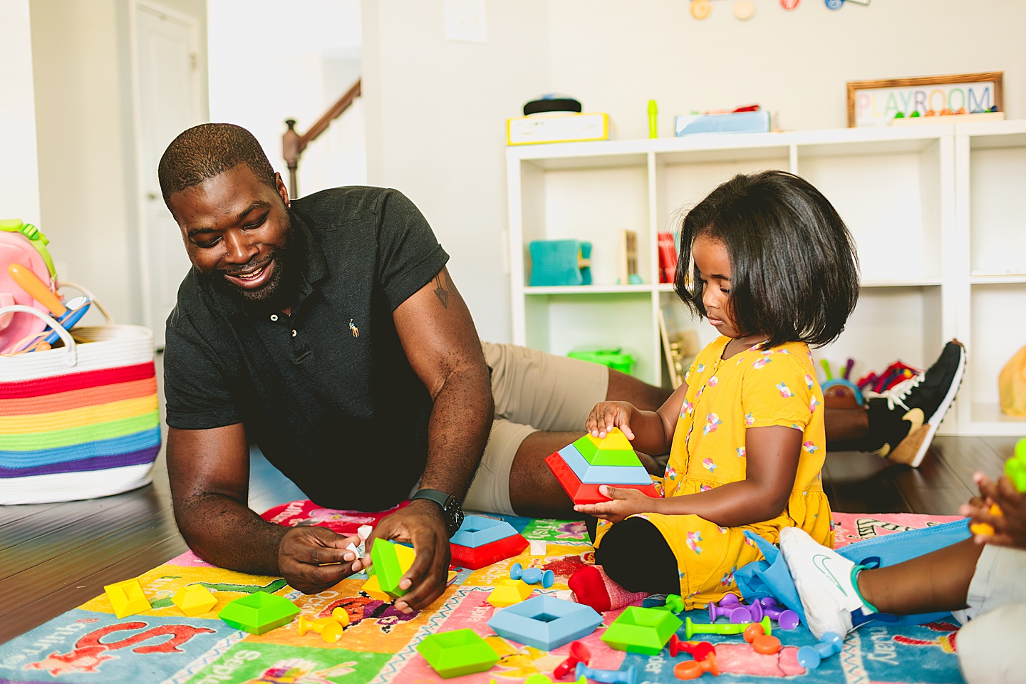 Dad playing Legos with kids