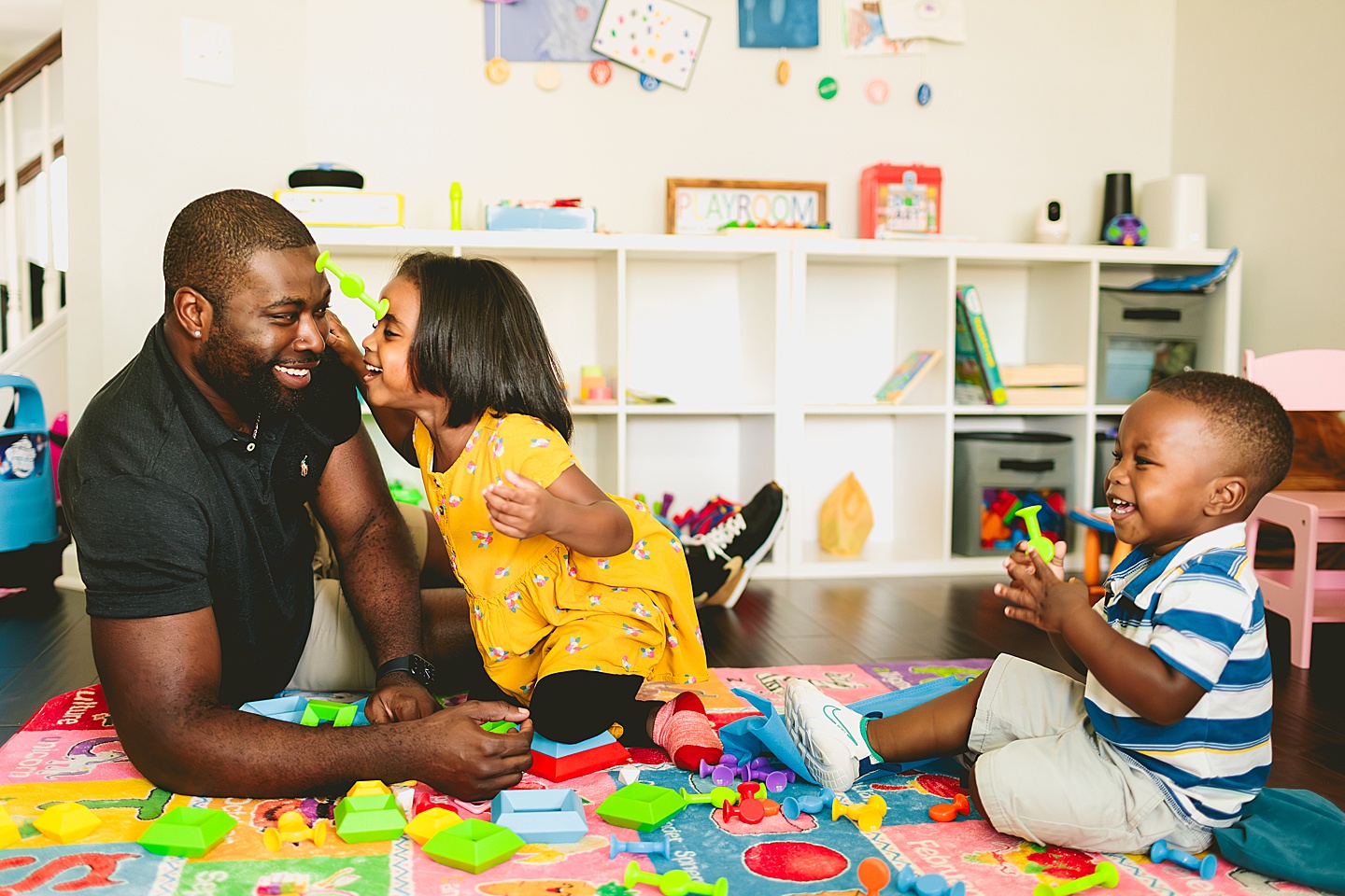 Dad playing Legos with kids