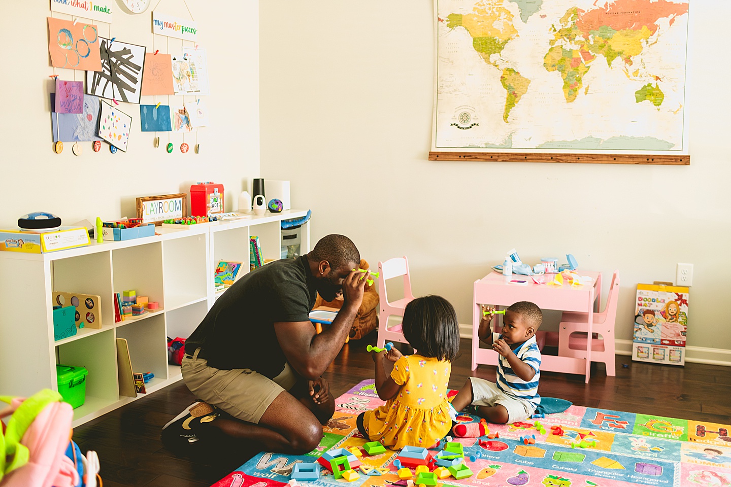 Dad playing Legos with kids