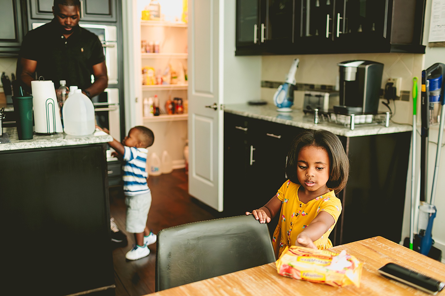 Kid getting snack in the kitchen