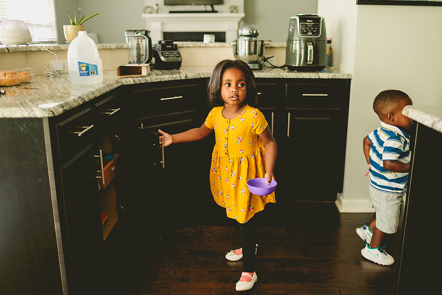 Kids getting snack in kitchen