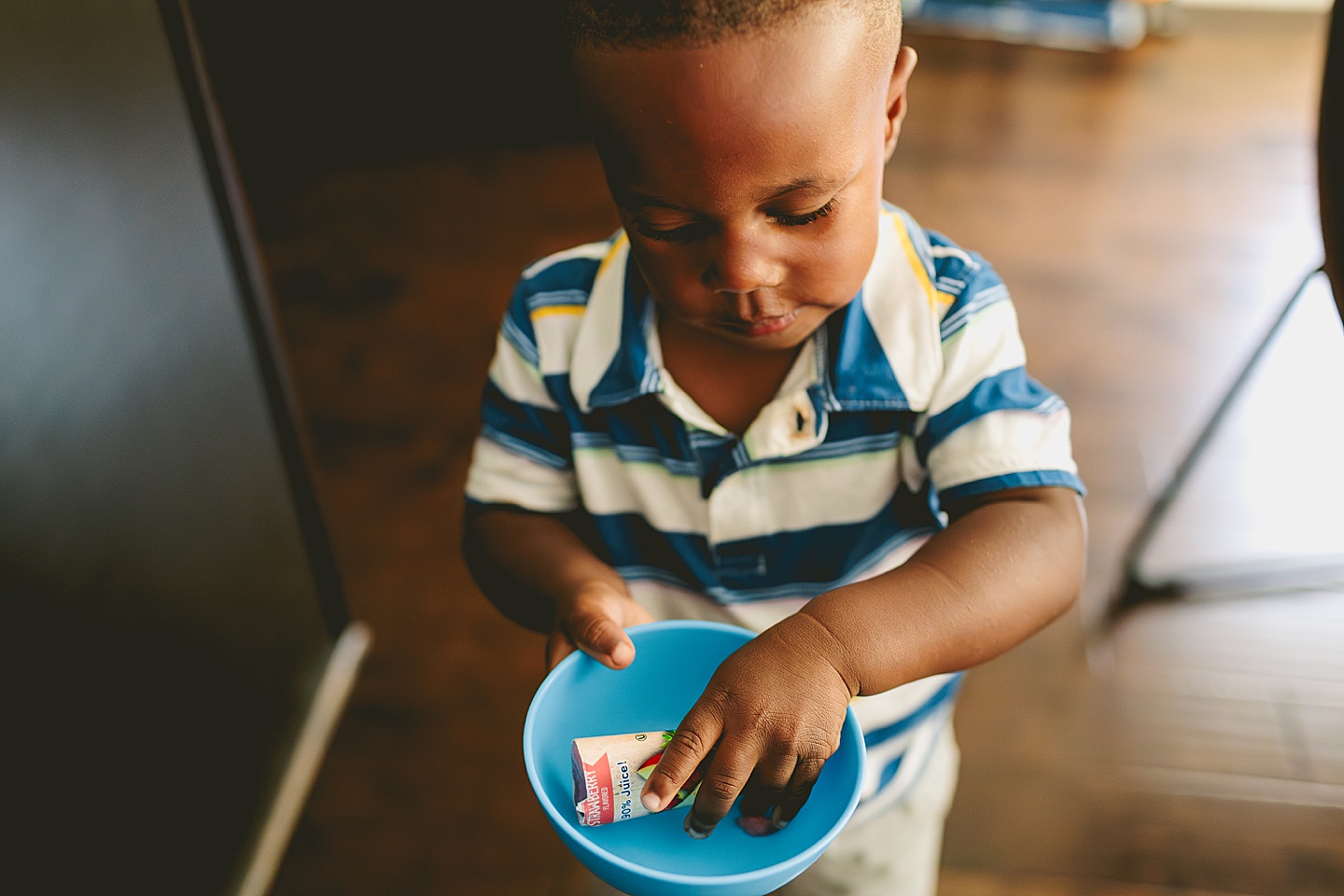 Kids getting snack in kitchen