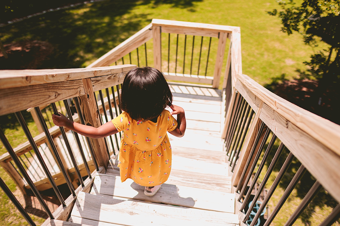 Girl walking down deck stairs