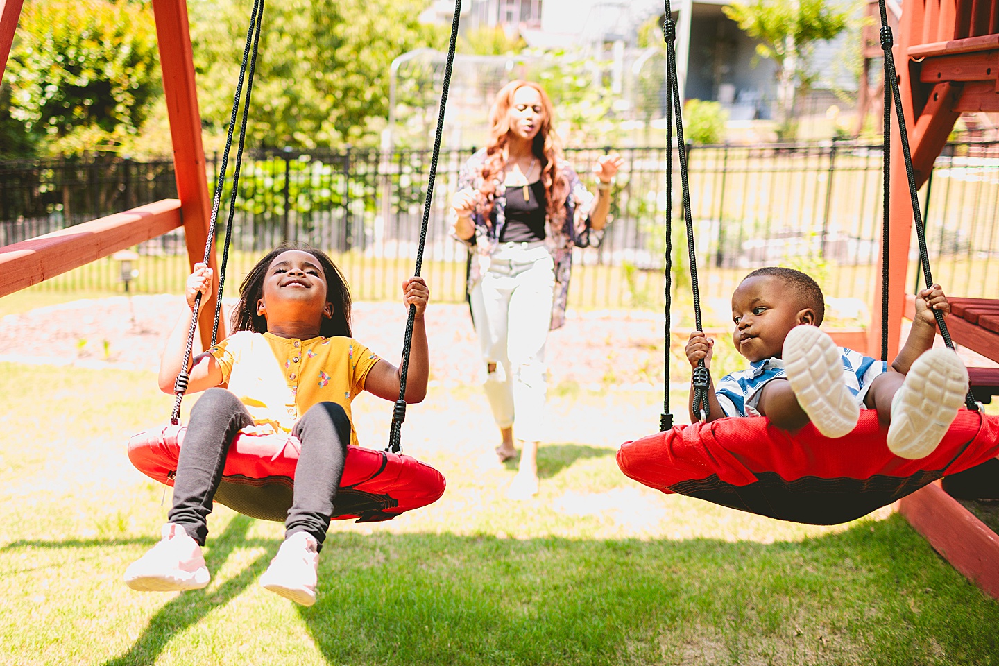 Kids swinging in backyard