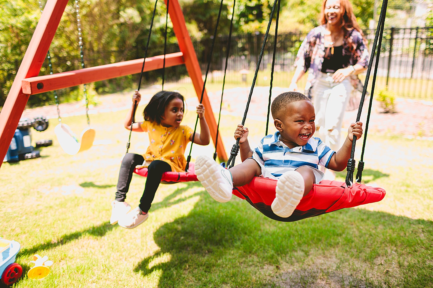 Kids swinging in backyard