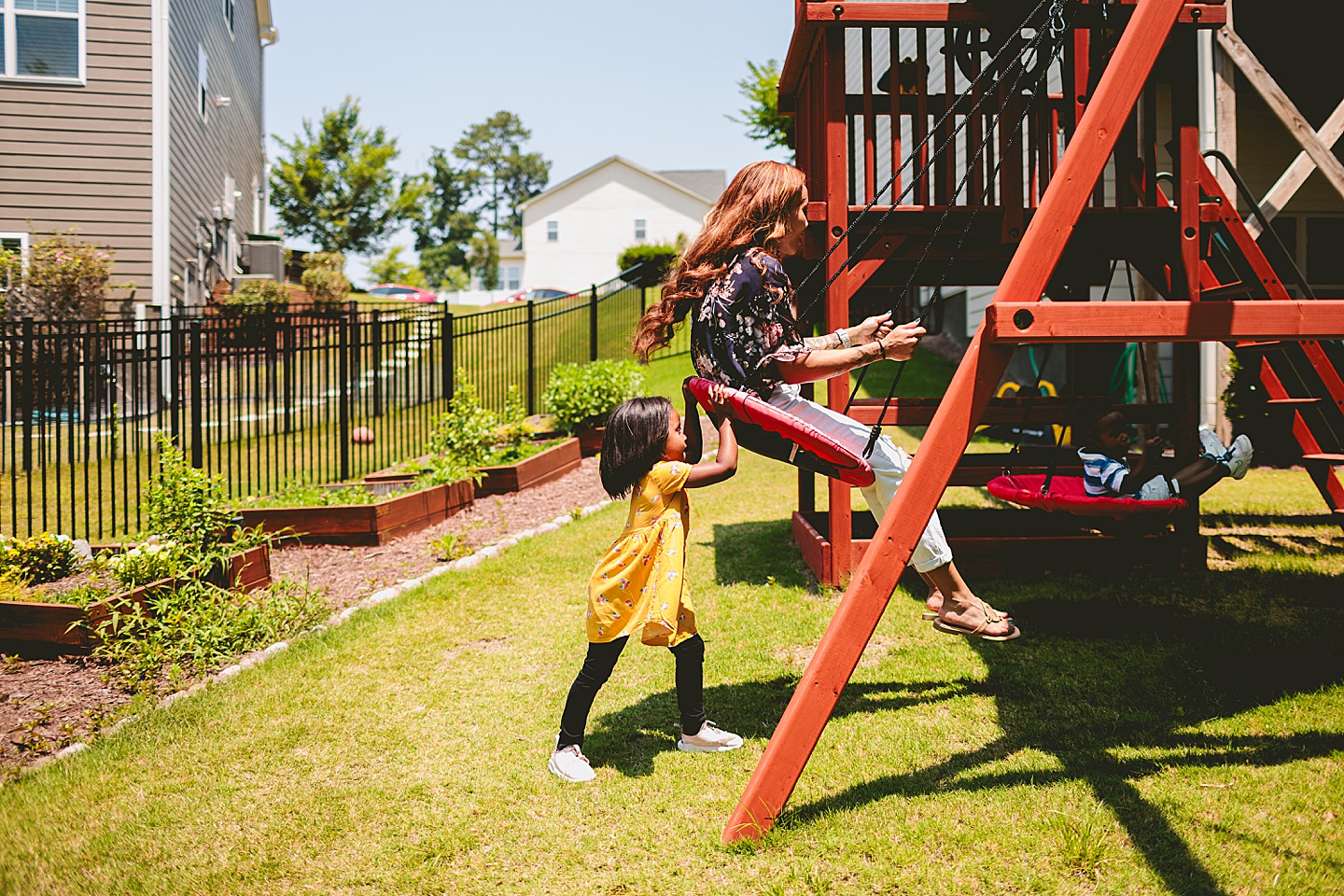 Kids swinging in backyard