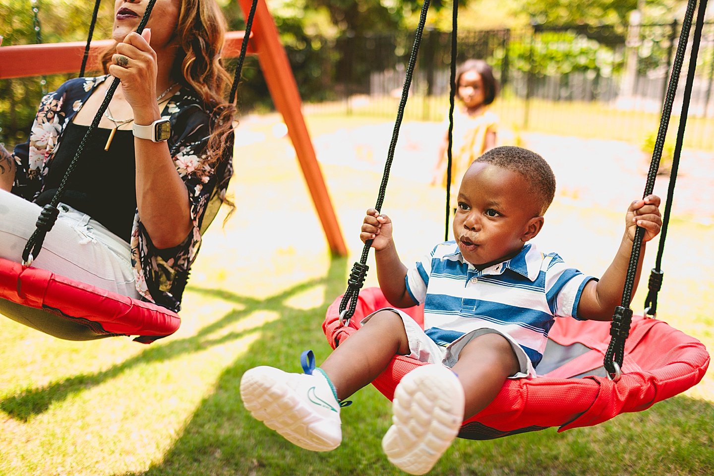 Kids swinging in backyard