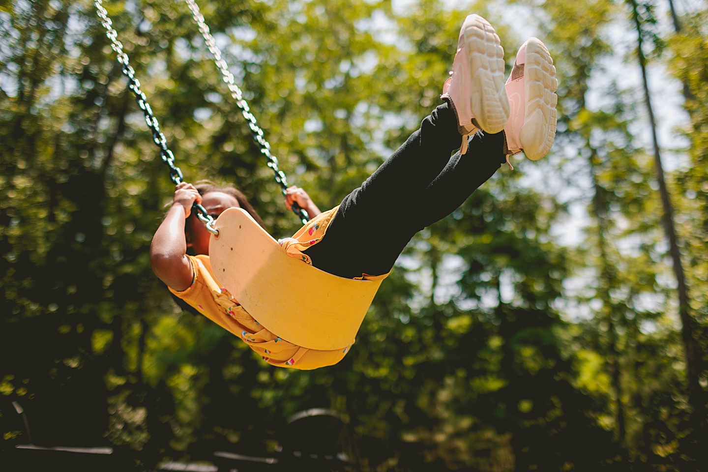 Kids swinging in backyard