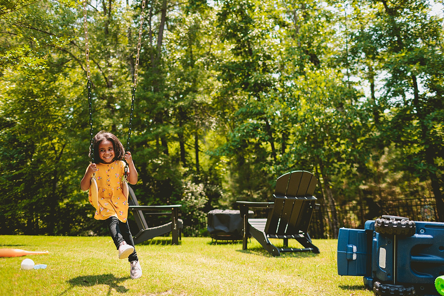 Kids swinging in backyard