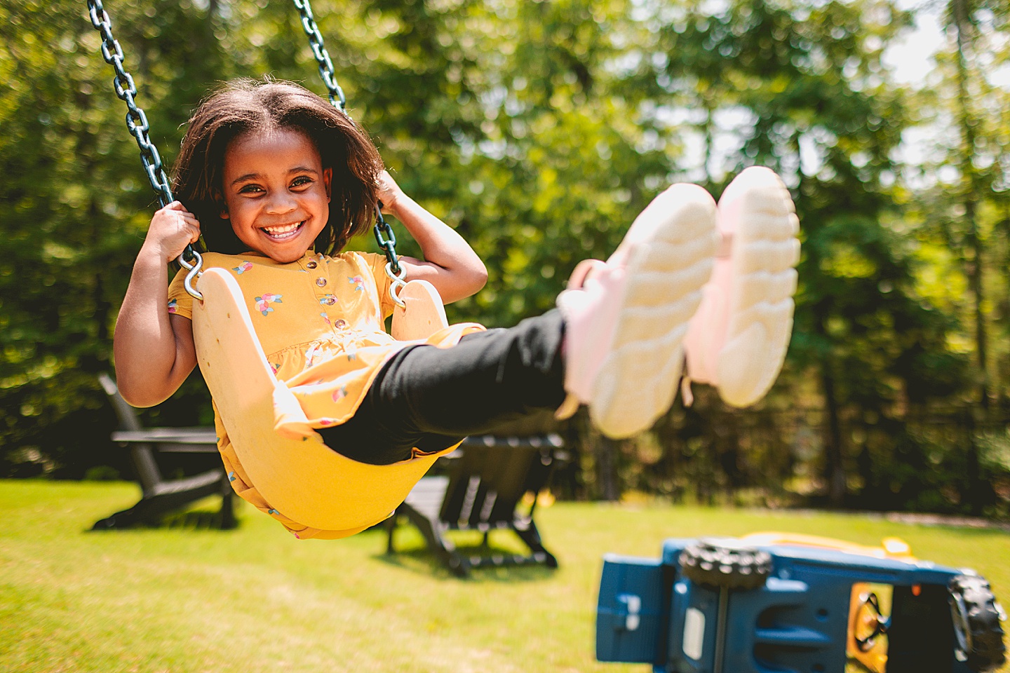 Kids swinging in backyard