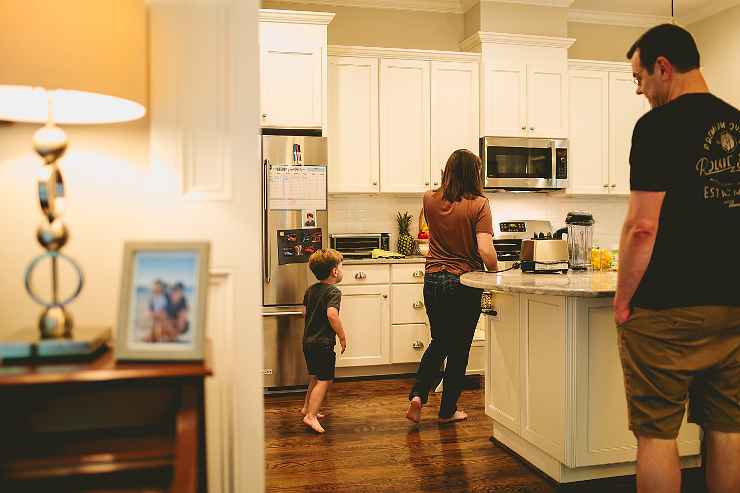 Family making breakfast in kitchen together