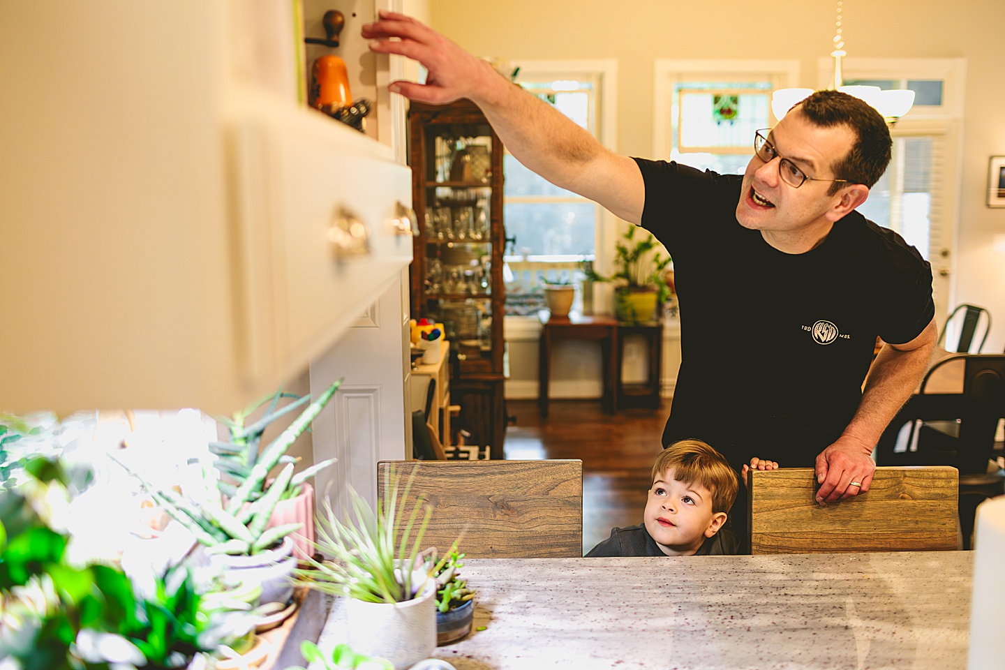 Child playing with toy nesting dolls