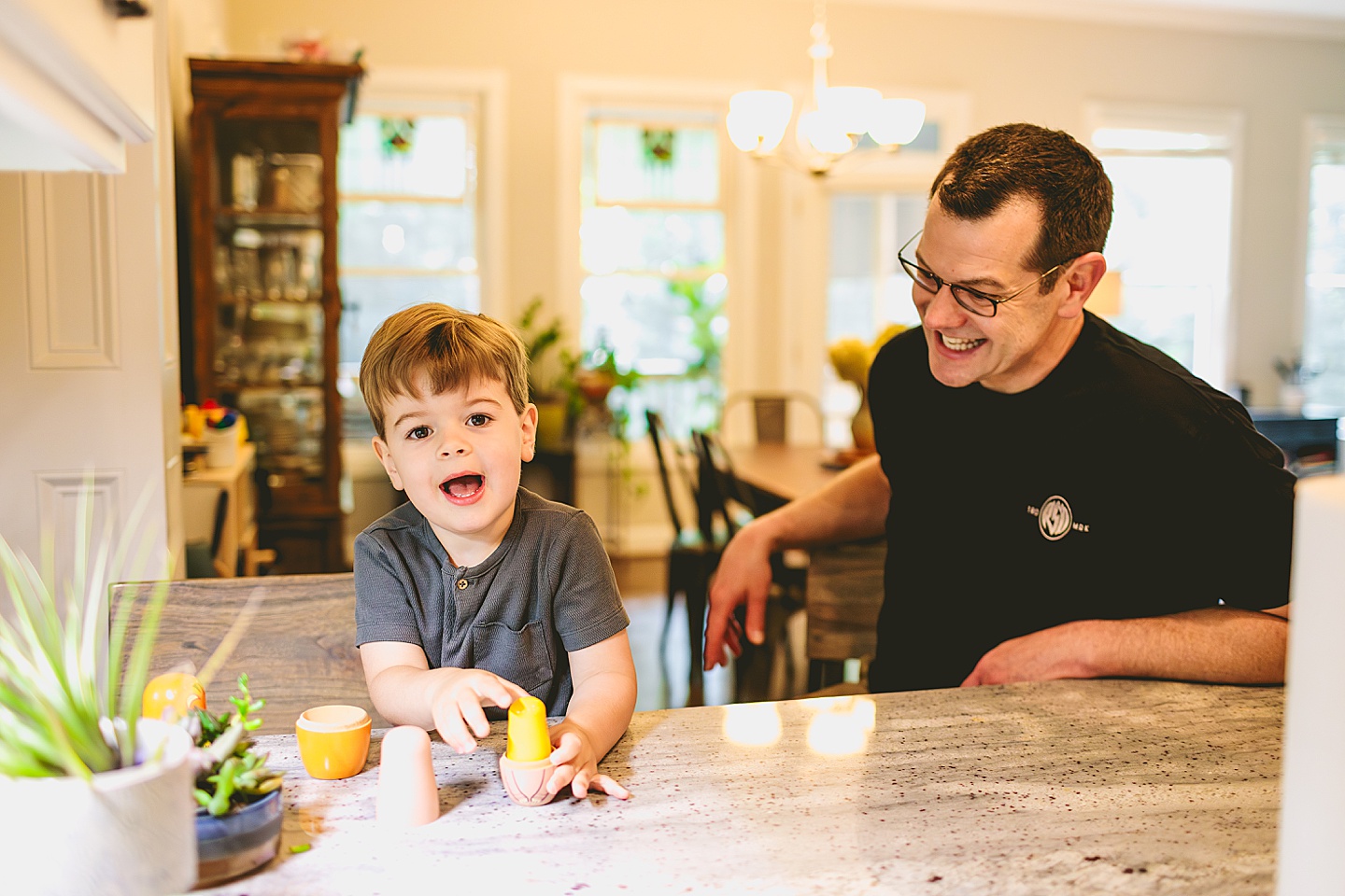 Child playing with toy nesting dolls