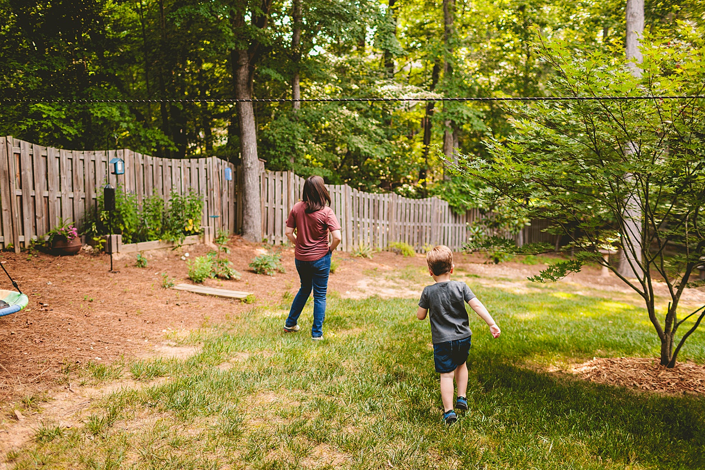 Child chasing his mom outside